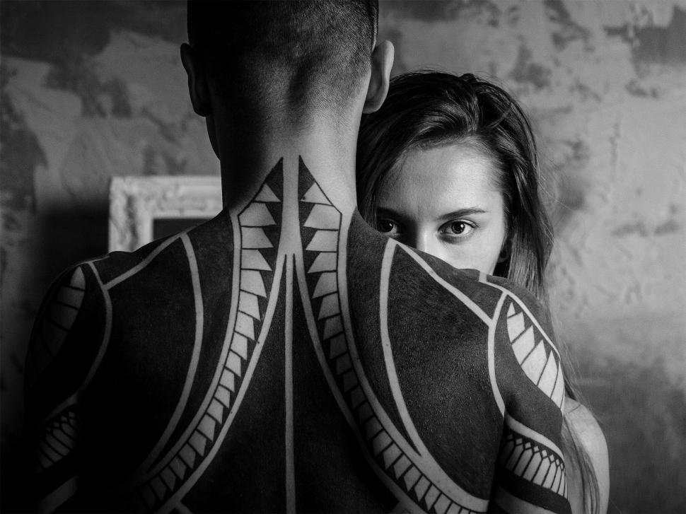 Free Image of Persons with tribal body art embracing 