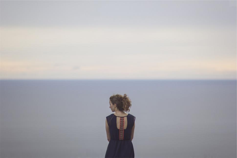 Free Image of Woman gazing at sea horizon 