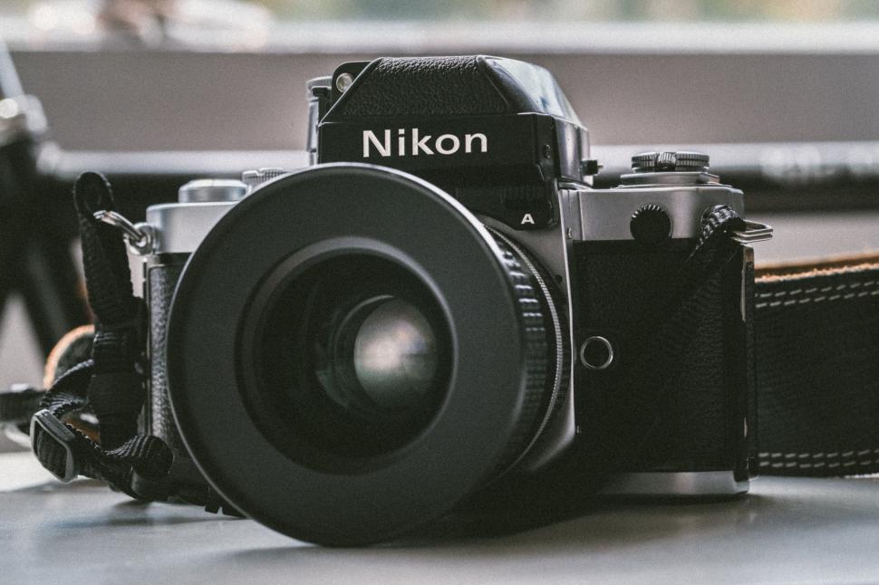 Free Image of Vintage Nikon camera on desk 