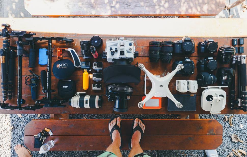Free Image of Photography equipment laid out on wood 