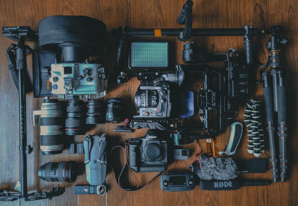 Free Image of Assorted camera equipment on wood 