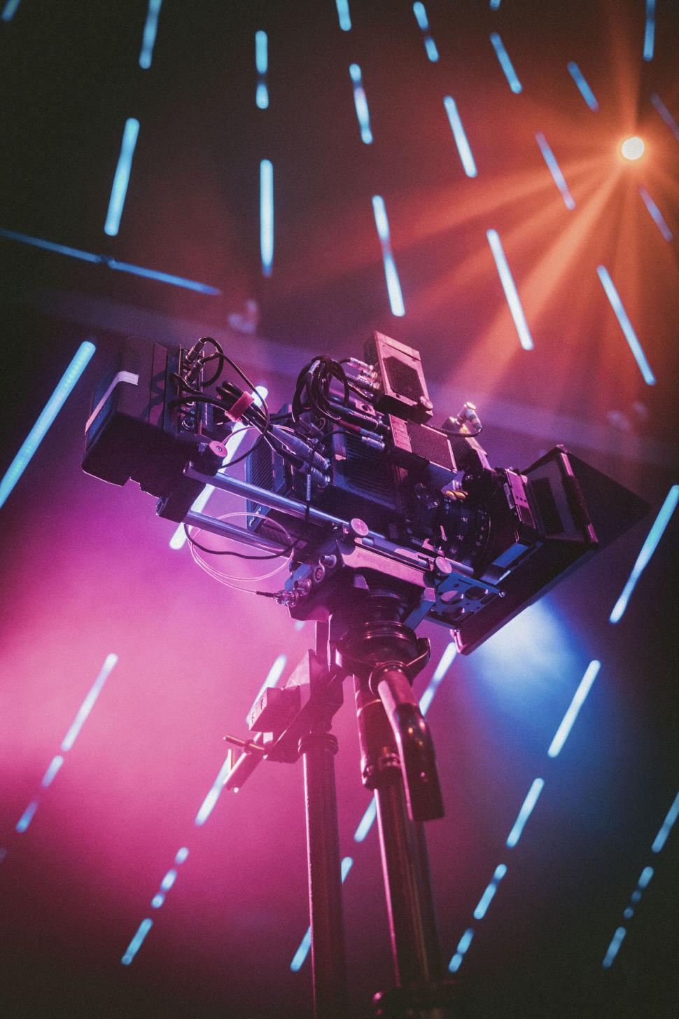 Free Image of Movie camera with colorful lighting 