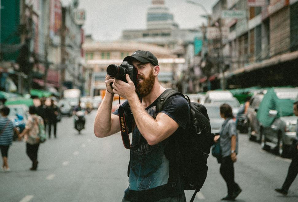 Free Image of Photographer shooting on urban street 