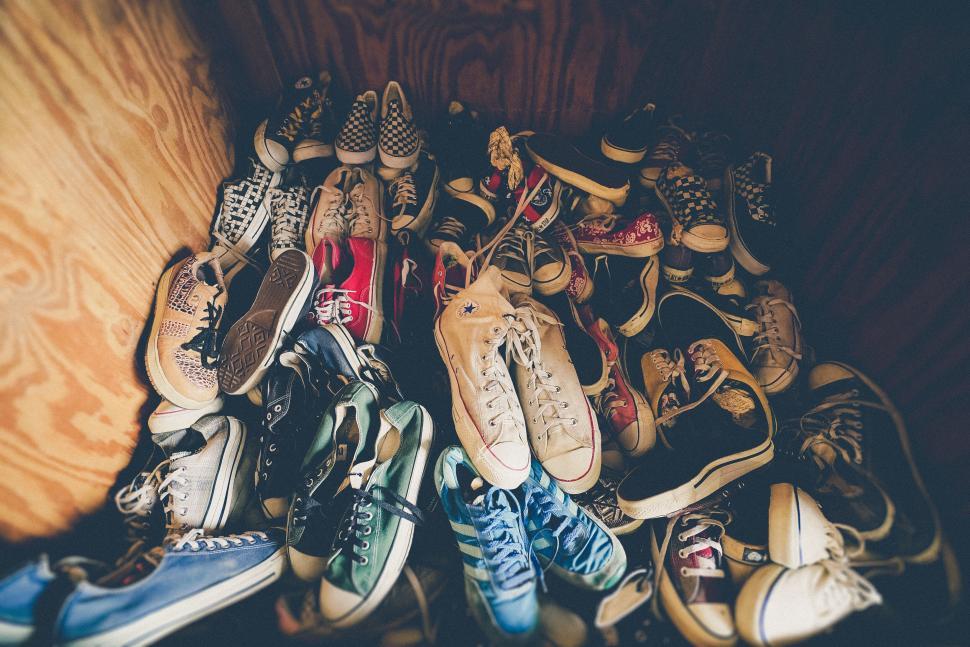 Free Image of Pile of assorted sneakers in a box 