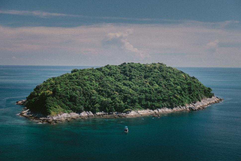 Free Image of Secluded island surrounded by blue sea 