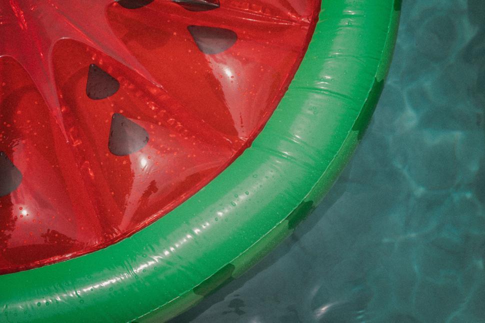 Free Image of Red watermelon float in pool 