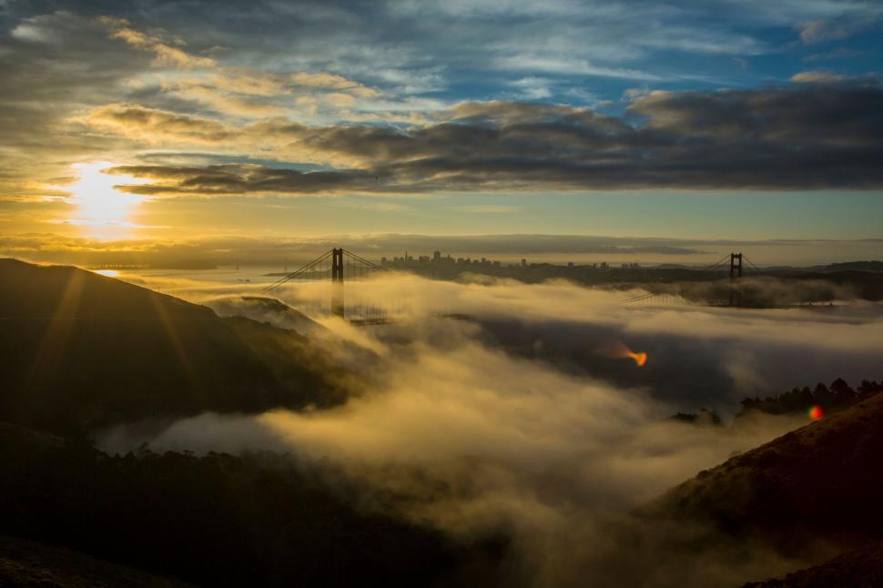 Free Image of Sunrise over fog-covered Golden Gate 