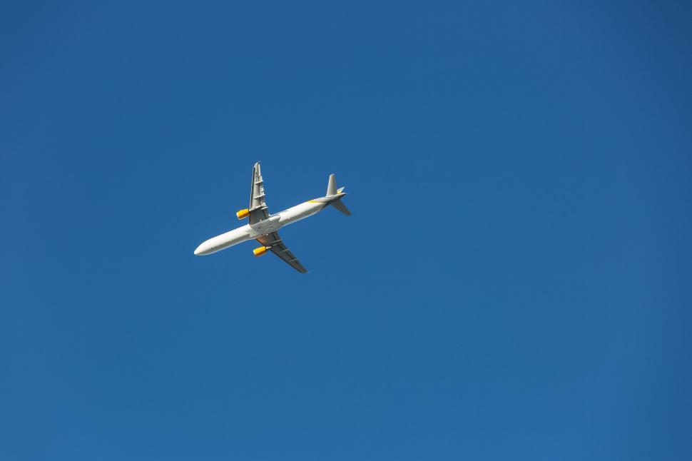 Free Image of Airplane flying in clear blue sky 
