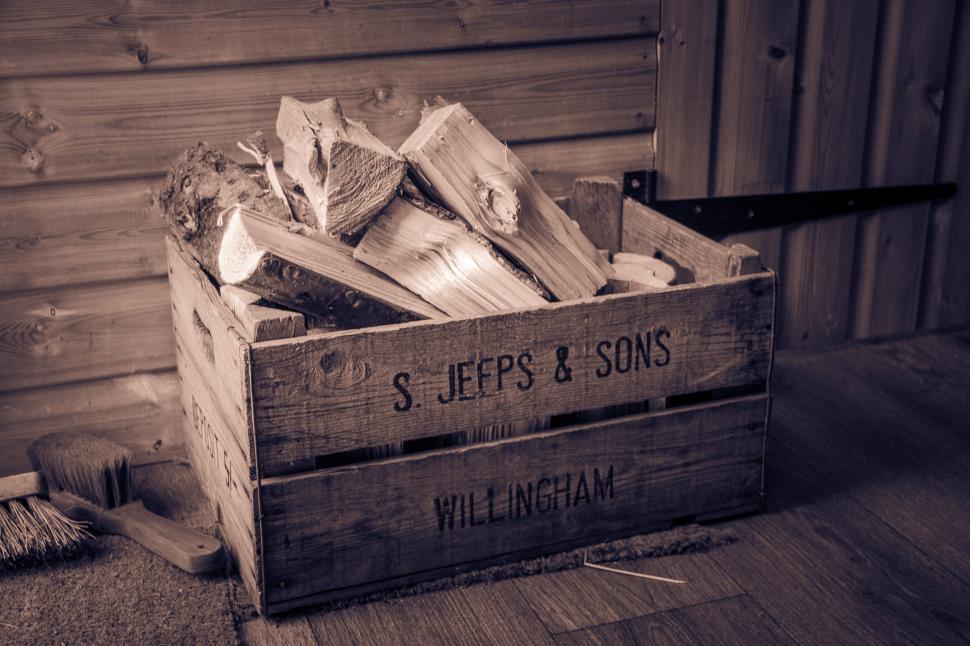 Free Image of Antique wooden crate with firewood 