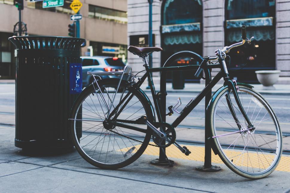 Free Image of Locked bicycle on a city street 