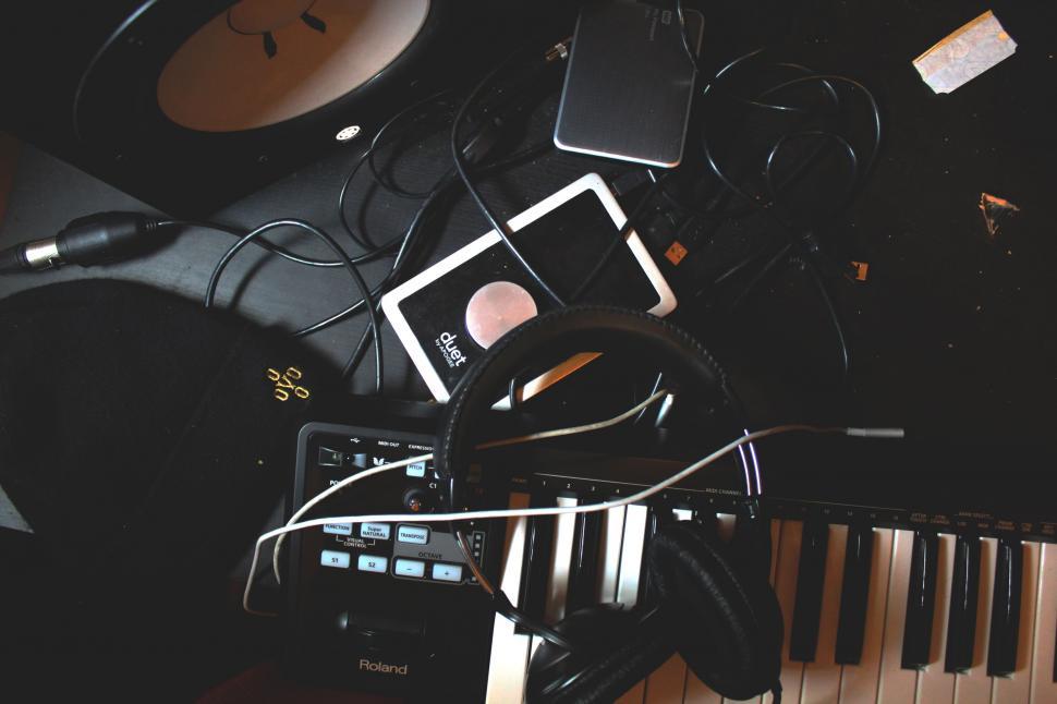 Free Image of Messy music producer s desk with gear 