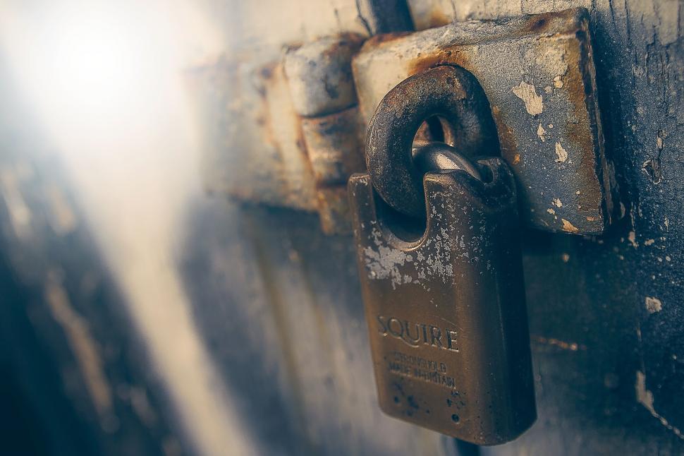 Free Image of Old padlock on a metal door 