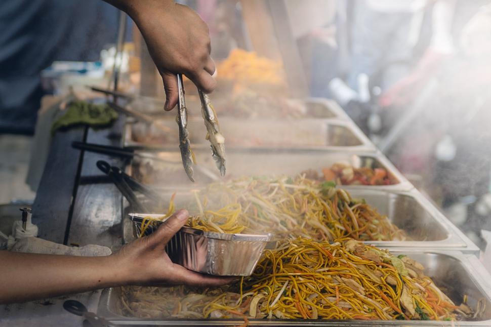 Free Image of Street food vendor serves noodles 