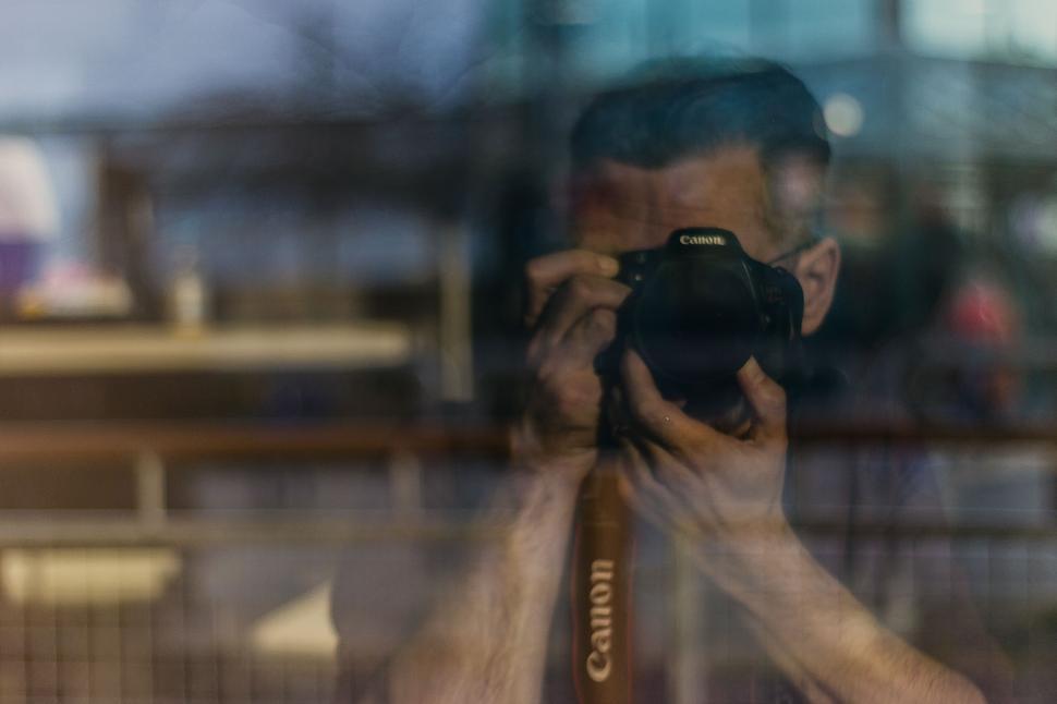 Free Image of Photographer s reflection in a window 