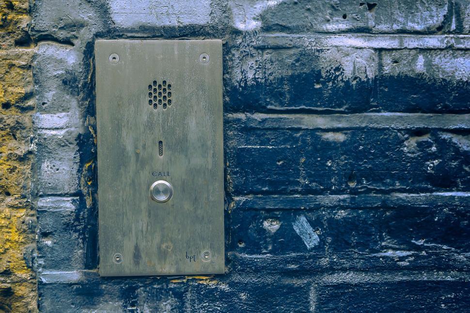 Free Image of Old call intercom on a brick wall 