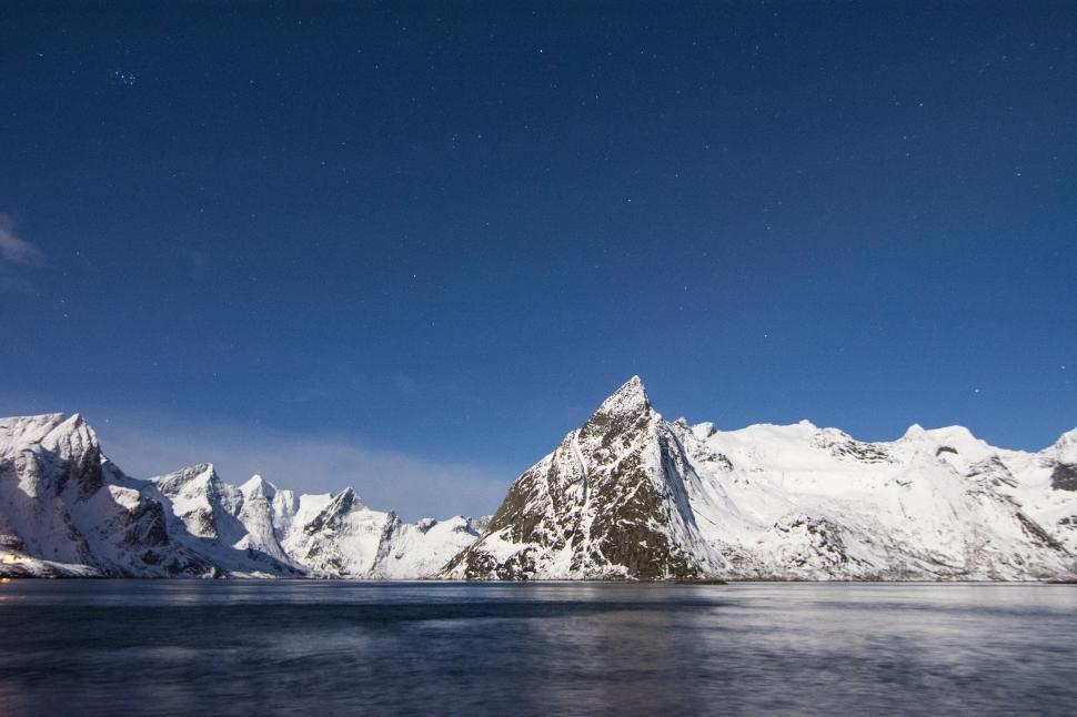 Free Image of Majestic snowy peaks under a starlit sky 