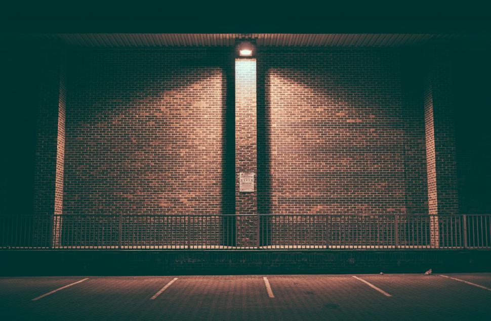 Free Image of Illuminated brick wall at night 
