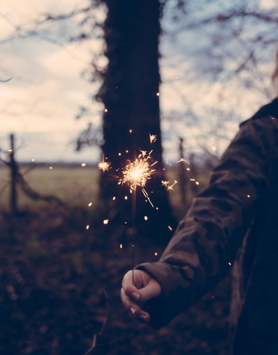 Free Image of Holding a sparkler in a twilight hour 