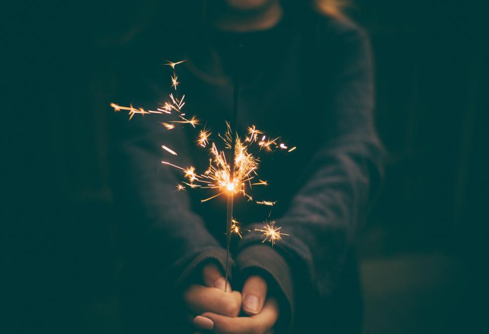 Free Image of Child holding a lit sparkler 