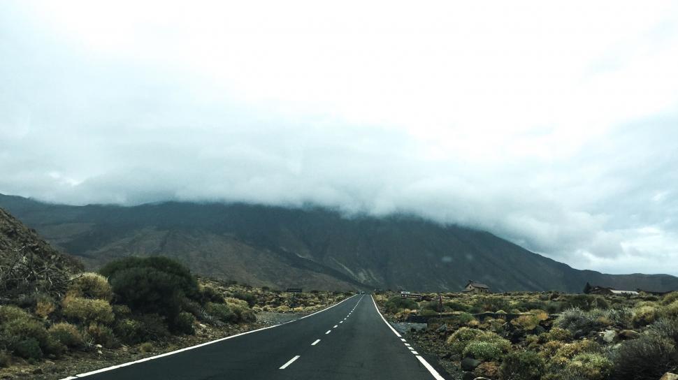 Free Image of Desolate road leading through arid landscape 
