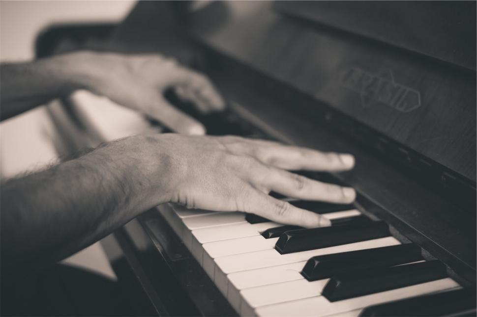Free Image of Pianist Hands on Vintage Piano Keys 