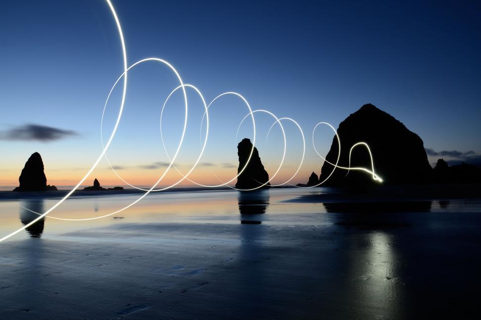 Free Image of Light painting on a beach at twilight 