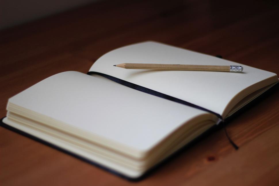 Free Image of Open notebook with wooden pencil 