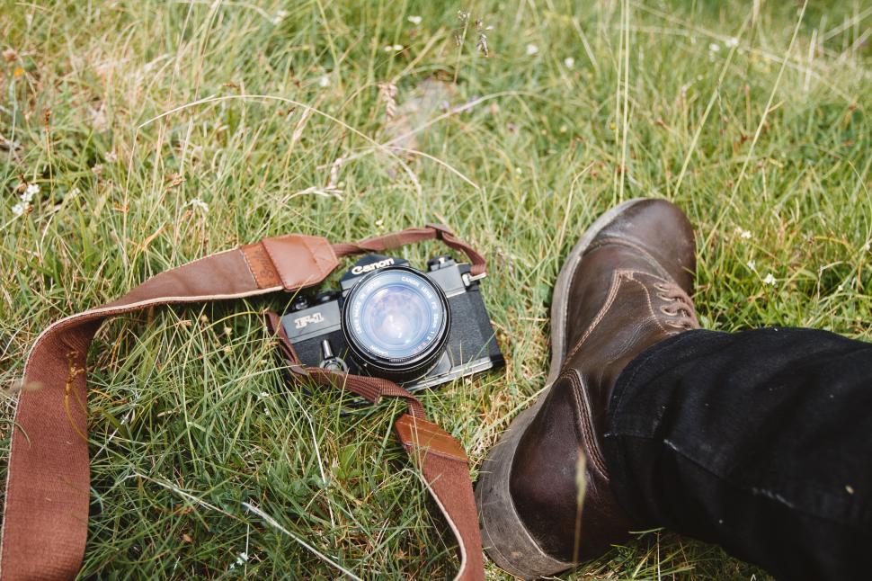 Free Image of Vintage camera and hiker s foot 