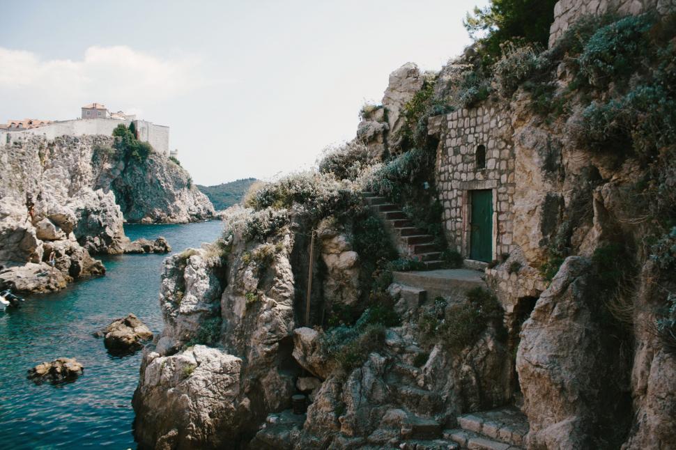 Free Image of Secluded rocky cove with staircase 