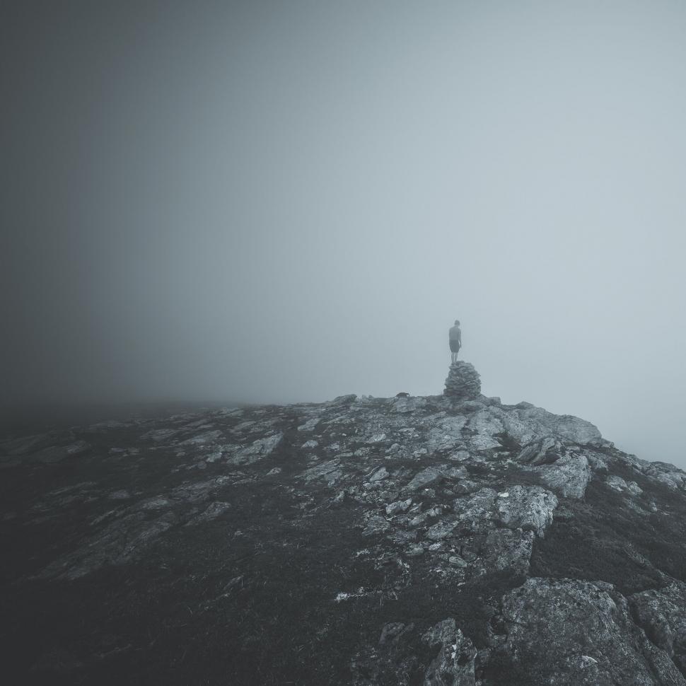 Free Image of Mysterious figure in foggy landscape 