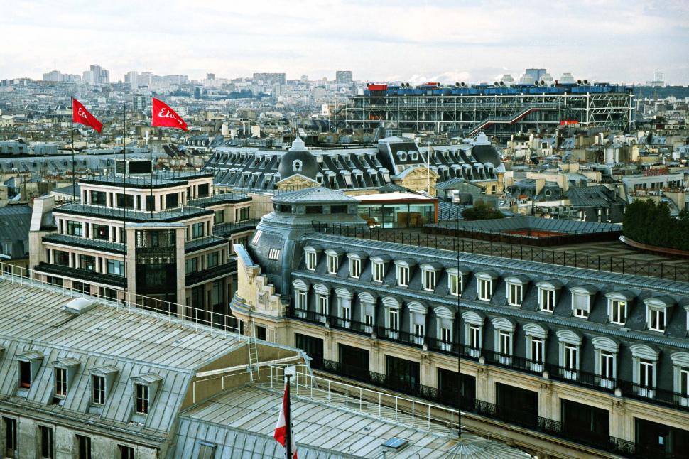 Free Image of france city flags buildings aerial skyline Centre Pompidou french historic Pompidou Center europe european paris urban rooftops roofs 