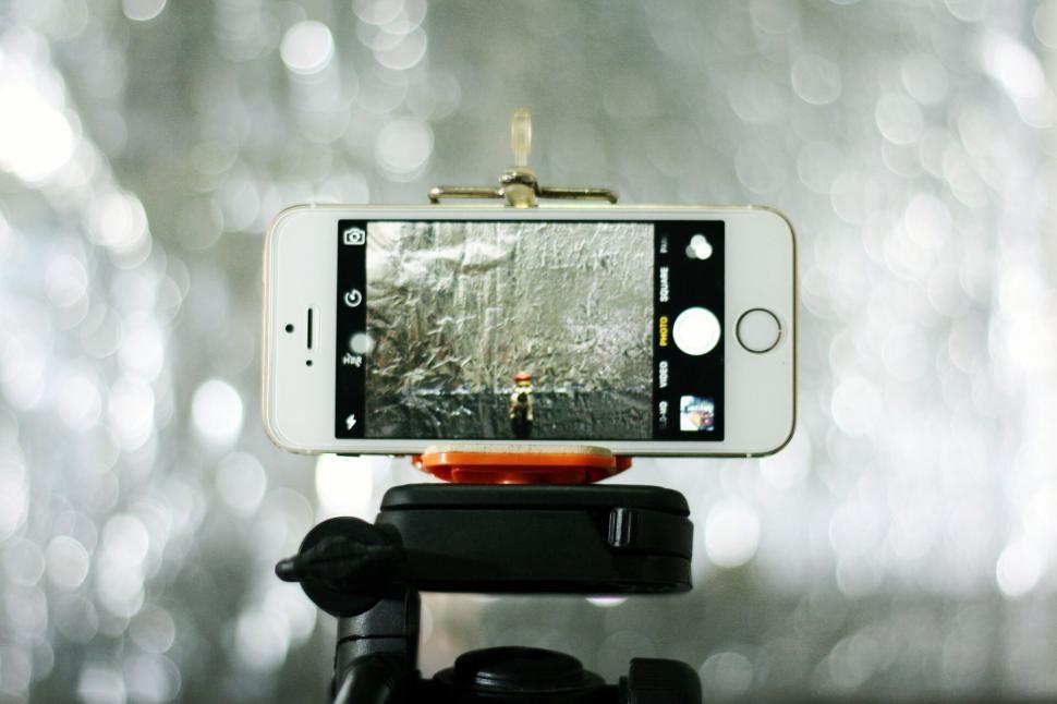 Free Image of Smartphone mounted on tripod for photography 