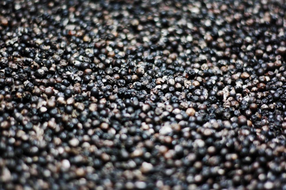 Free Image of Black peppercorns texture background 