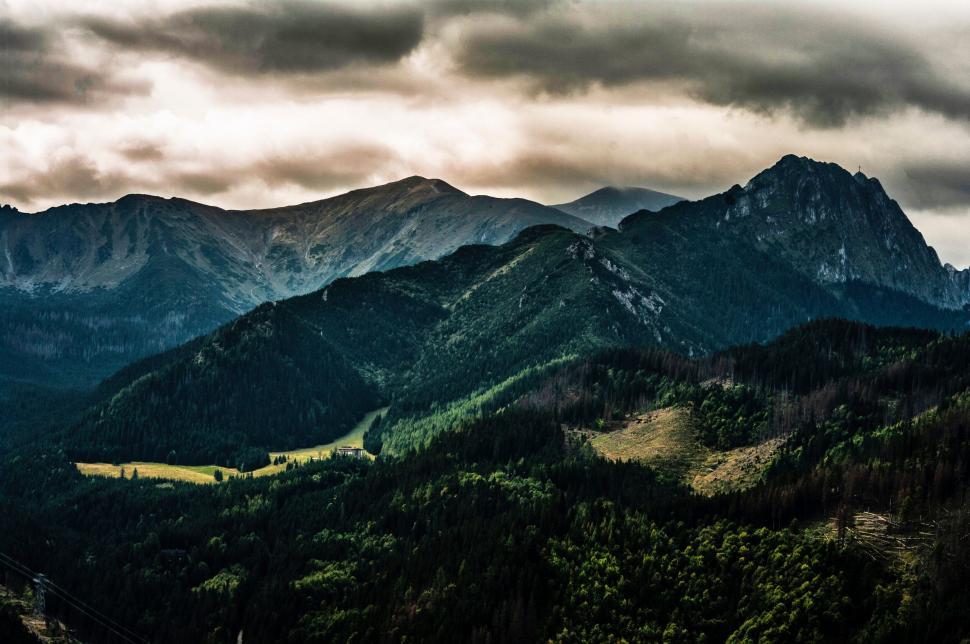 Free Image of Mountain range with dramatic cloudy sky 