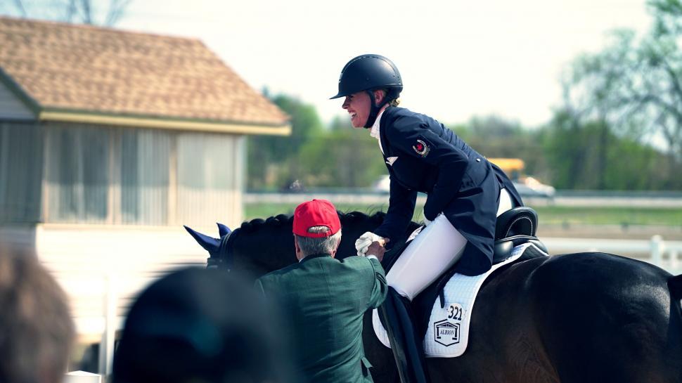Free Image of Equestrian rider receiving coaching 