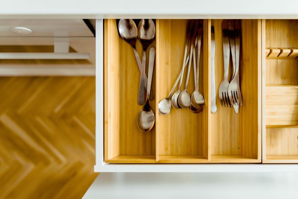Free Image of Organized kitchen drawer with utensils 