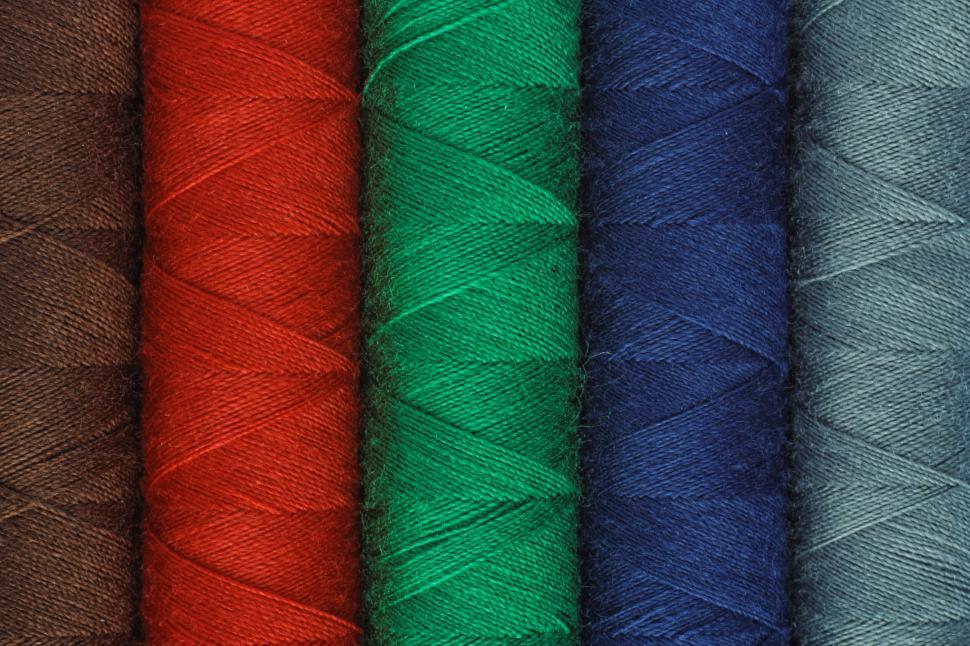 Free Image of Colorful rows of sewing threads 