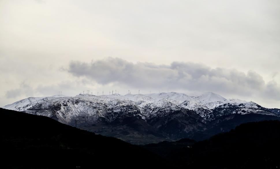 Free Image of Snow-capped mountains with cloudy sky 