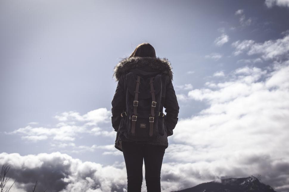 Free Image of Back view of person looking at clouds 