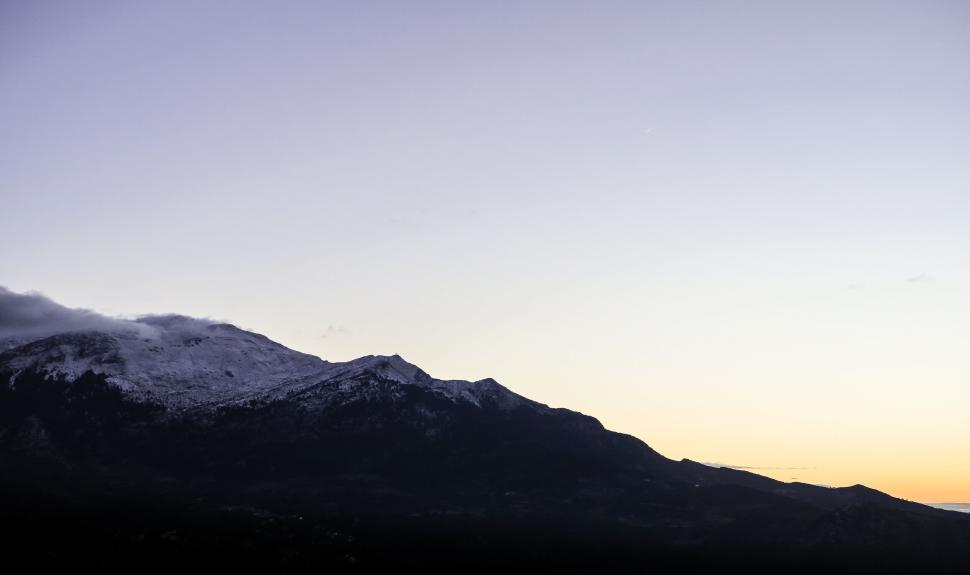 Free Image of Snow-capped mountain at dusk 