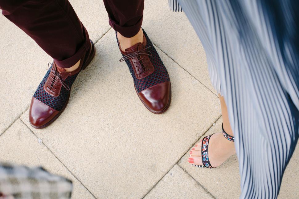Free Image of Close-up of couple s stylish footwear 