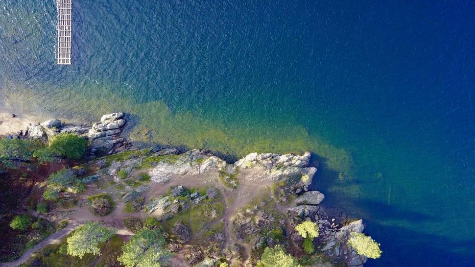 Free Image of Top-down view of rocky lakeshore 