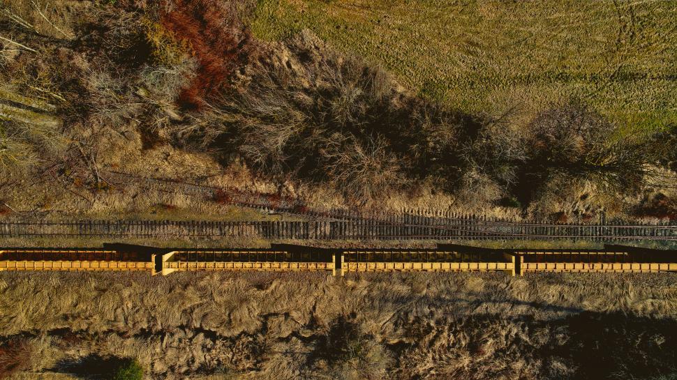 Free Image of Aerial of a train crossing a bridge 