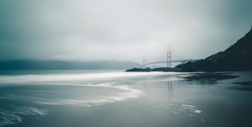 Free Image of Foggy beach view with Golden Gate Bridge 