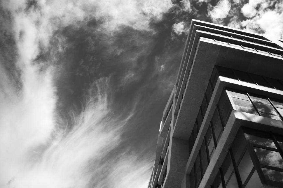 Free Image of Modern building with dramatic sky above 