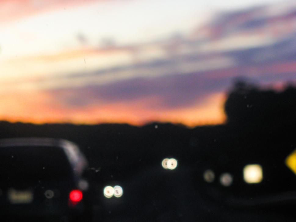 Free Image of Blurry sunset on a highway drive 