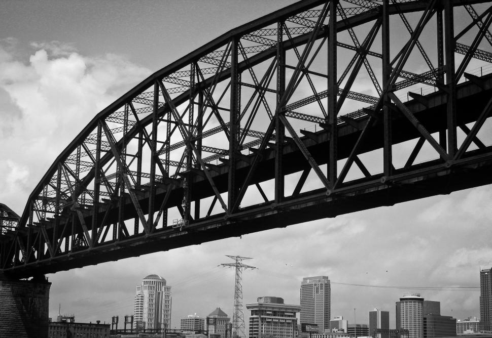 Free Image of Black and white bridge with city background 