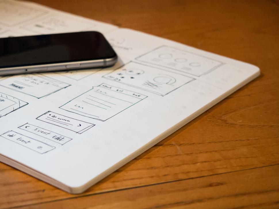 Free Image of Notebook with mobile app design sketches 