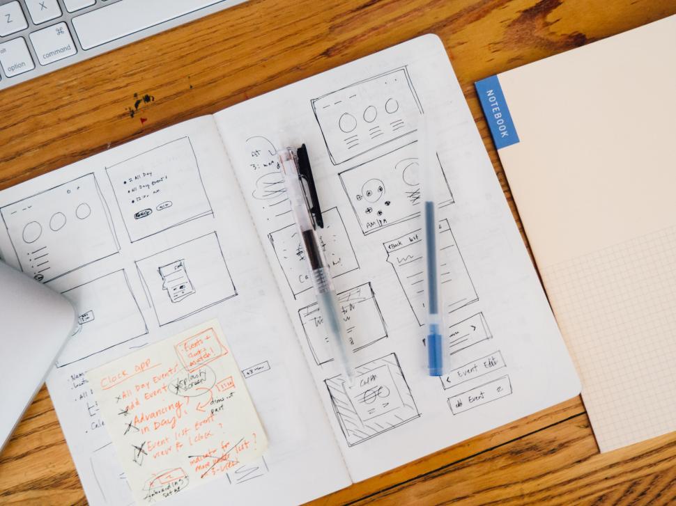 Free Image of Workspace with UIUX design sketches and notes 