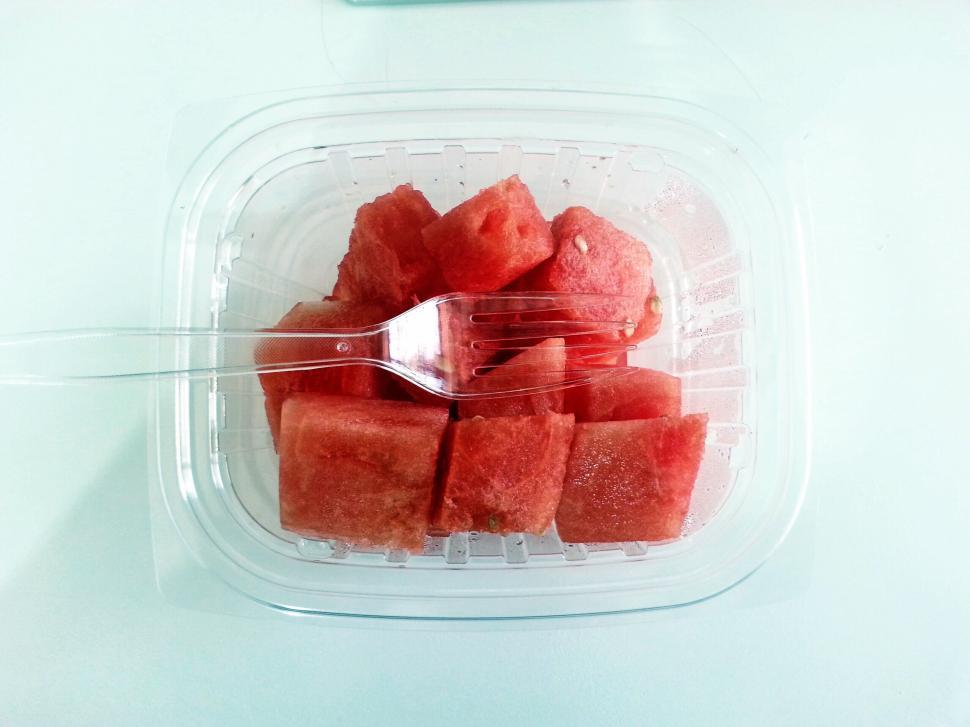 Free Image of Watermelon chunks in a clear container 